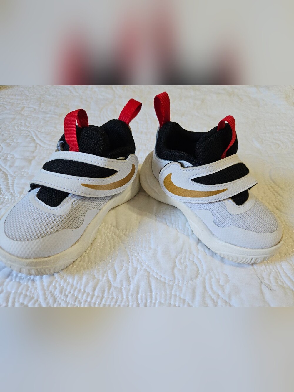 Nike Kids White and Black Sneakers with Gold Swoosh and Red Pull Tabs